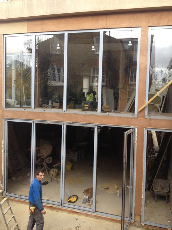 Aluminium bi-fold doors with two-storey glazing in Harpenden