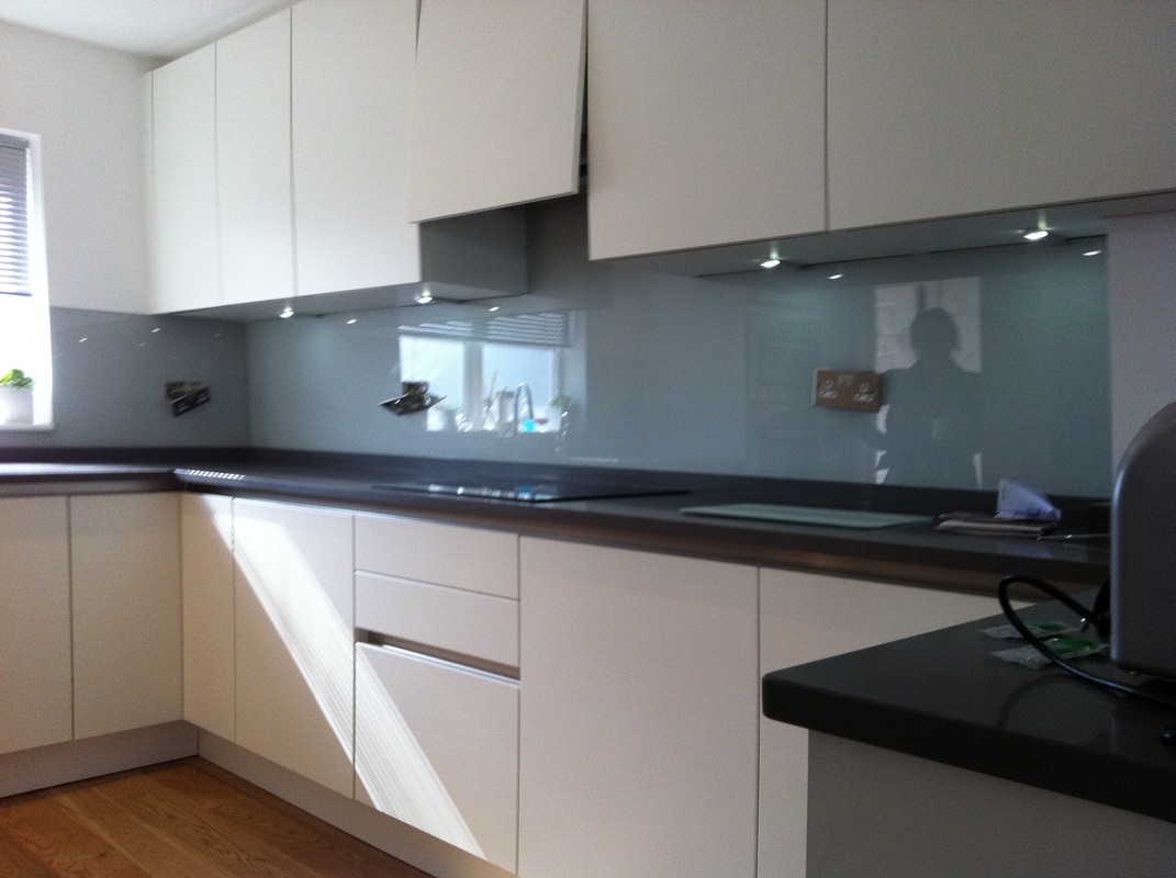 Grey glass kitchen splashback with LED lighting in Harpenden