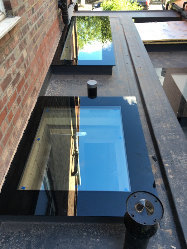 Multiple flat roof skylights on extension in Harpenden